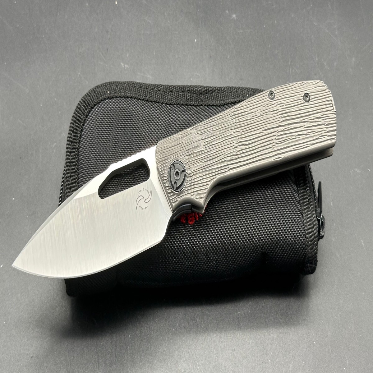 Liong Mah Field Duty barked texture blackwashed titanium handle wM390 blade